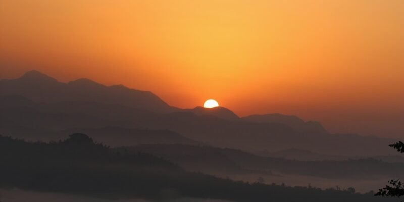 sun peeping on ice mountain